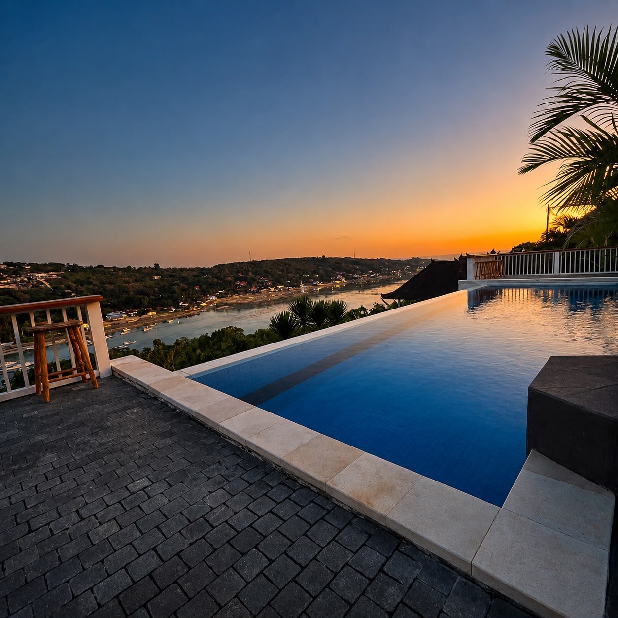 Infinity swimming pool overlooking to yellow bridge nusa lembongan and nusa ceningan